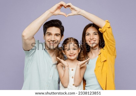 Young parents mom dad with child kid daughter girl 6 year old wear blue yellow casual clothes show shape heart with hands above head pov roof isolated on plain purple background. Family day concept