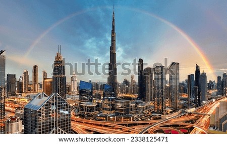 Rainbow over Skyline of Dubai bussines downtown at sunrise, United Arab Emirates