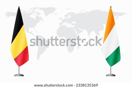 Belgium and Ivory Coast flags for official meeting against background of world map. Royalty-Free Stock Photo #2338135369