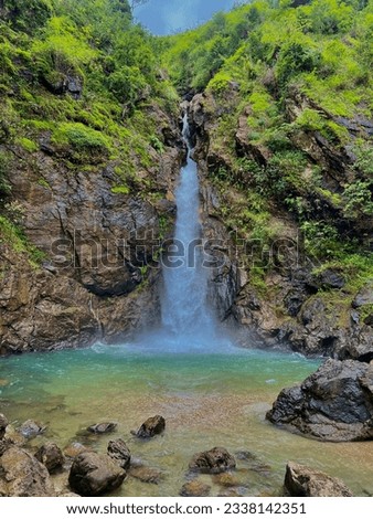 Picture of a mountain waterfall in the rainy season the abundance of green forests beautiful nature clear blue water