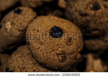 Chocolate cookies on top with raisins.