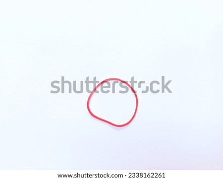 Red elastic rubber band in circle shape isolated on white background.