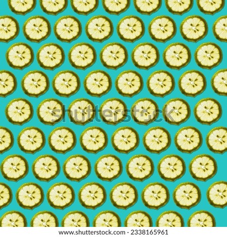 Fresh lemon slices against blue-green background forming a beautiful wallpaper texture pattern background.