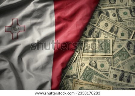 big colorful waving national flag of malta on a american dollar money background. finance concept Royalty-Free Stock Photo #2338178283