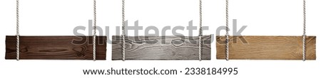 Set of wooden signs hanging on ropes, isolated on white background