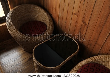 Luxury interior of wooden empty sitting arrangement with tea table close view.