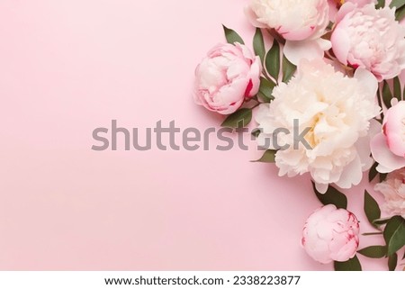 Tender peonies on pink background with copy space. Abstract natural floral frame layout with text space. Romantic feminine composition. Wedding invitation. International Women day, Mother Day concept Royalty-Free Stock Photo #2338223877