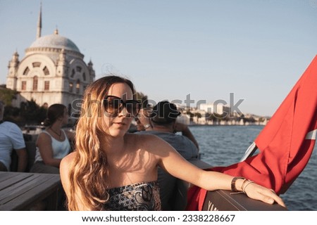 Female Model on a boat in Istanbul, Turkey with the turkish flag 