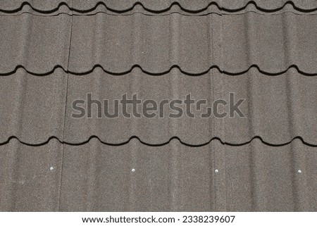 Photo of stone coated and ceramic roof tiles reflects heat well.