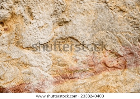 Stone background texture. Old aged beige stone wall or floor, rock pattern