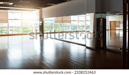 Interior of sport and dancing hall with hardwood floor and mirror