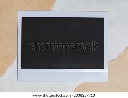Blank photo frame on brown background as template for design. Photo card with space for your logo or text.