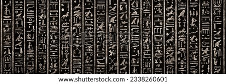 Old Egyptian hieroglyphs on an ancient background. Wide historical and culture background. Ancient Egyptian hieroglyphs as a symbol of the history of the Earth.  Royalty-Free Stock Photo #2338260601