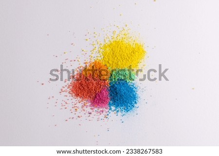 Close up of multi coloured sand and copy space on white background. Sand, texture, movement, shape and colour concept. Royalty-Free Stock Photo #2338267583