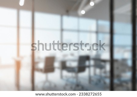Modern Office Interior with Beautiful Lighting. Blurred abstract grey glass wall from a building background. Royalty-Free Stock Photo #2338272655