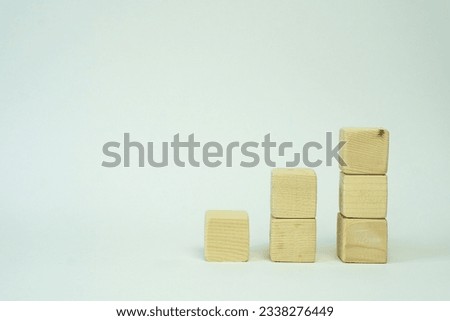 Wooden cubes, blank for work, finance, logo, and writing. On a white isolated background. Space for text. graphic cubes