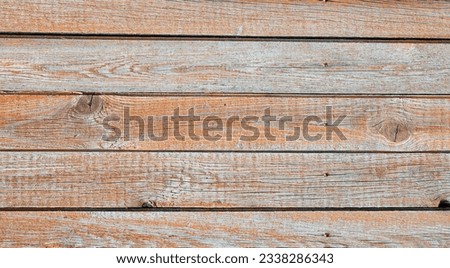 A fence made of pine boards. Old, worn, cracked board. Texture, background. Royalty-Free Stock Photo #2338286343