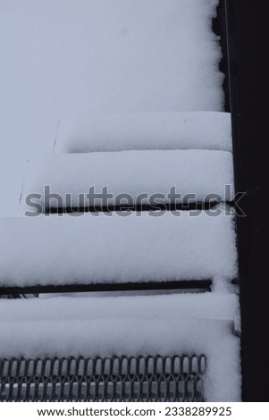 snow covered small wooden stairway