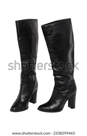A pair of black elegant female boots or woman shoes isolated on a white background. Leather boots. Royalty-Free Stock Photo #2338299465