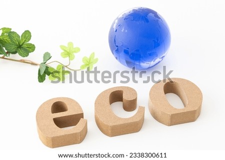 An alphabet craft representing ECO and an object of the earth.