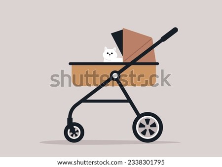 A pampered cat sitting in a baby stroller Royalty-Free Stock Photo #2338301795