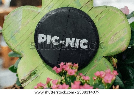 Pleasant picnic area in the park with Picnic sign