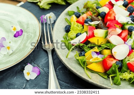 Healthy vegetable salad with edible flowers. Clean eating, ketogenic.