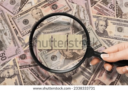 consumer price concept. magnifying glass and money