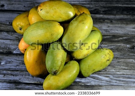 Pile of Egyptian fresh mango fruit with tropical delicacy, mangoes are nutritionally rich fruit with distinctive flavor, smell, taste, selective focus of Taimoor and Alphonso Mango fruit