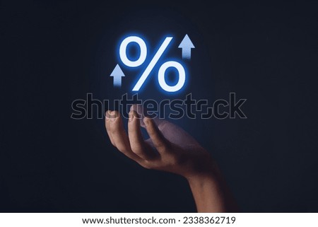 Interest rate on financial businessman hand and mock interest rate added top with percentage symbol.