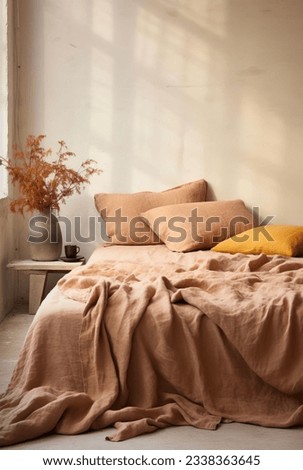 Our Warm Tones Bedroom photograph showcases a blend of earthy colors and natural textures, creating a cozy Mediterranean-inspired space adorned with warm autumn hues. Royalty-Free Stock Photo #2338363645