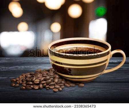 Steaming hot latte in mug on bar background