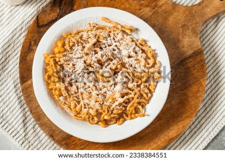 Sweet Powdered Sugar Funnel Cake at a Fair Royalty-Free Stock Photo #2338384551