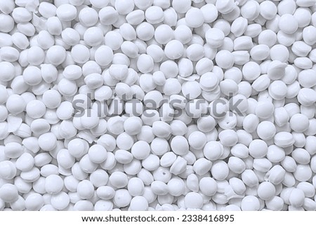 White recycled plastic pellets made of HDPE Royalty-Free Stock Photo #2338416895