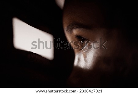 .Peep, hole and eye to spy for security or face at the window looking in the dark, shadow or neighbour with a peephole in a door. Anxiety, watching or eyes of person in apartment, home or house. Royalty-Free Stock Photo #2338427021