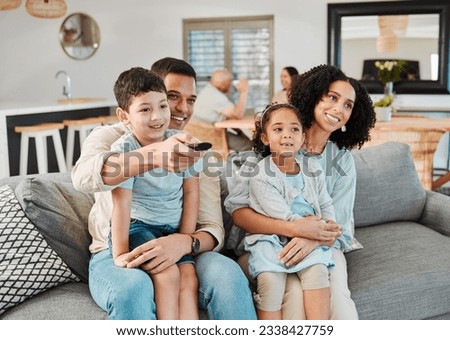 Remote, relax and happy family watching tv show, movie or decision on broadcast, kids entertainment or film. Lounge, channel surfing choice and home children, mother and father view television series Royalty-Free Stock Photo #2338427759