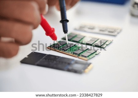 Hands, motherboard and engineer solder circuit board for technology, electrical hardware or CPU microchip. Closeup, technician and iron welding tools for IT maintenance, upgrade or test semiconductor Royalty-Free Stock Photo #2338427829