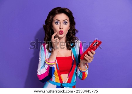 Photo of adorable lovely lady finger touch face wear retro clothes hand hold iphone speed wifi isolated on purple color background
