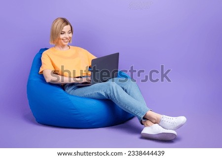 Full length body photo of young businesswoman lying pouf comfortable with netbook create code program isolated on purple color background Royalty-Free Stock Photo #2338444439