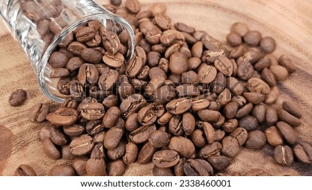 Coffee beans on wooden floor, Arabica coffee, good quality coffee beans.