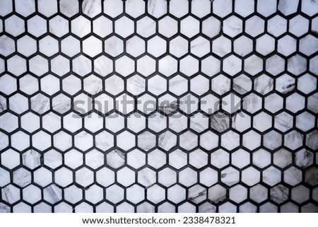 Close up of gray honeycomb, hexagon ceramic tile pattern wall