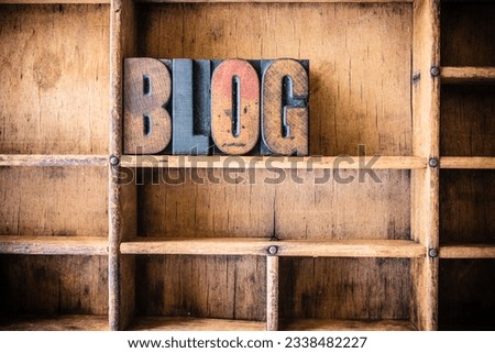 The word BLOG written in vintage wooden letterpress type in a wooden type drawer.