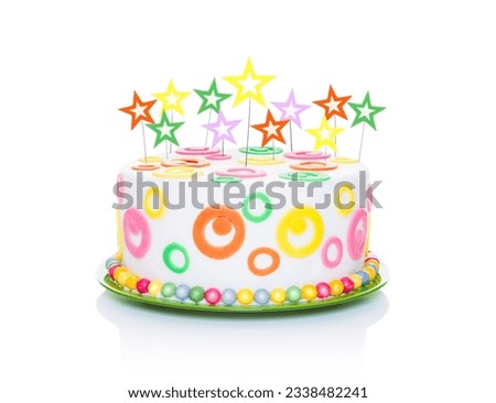 happy birthday cake or tart with star candles very colorful and looking very tasty, isolated on white background