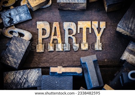 The word PARTY written in rusted metal letters surrounded by vintage wooden and metal letterpress type.