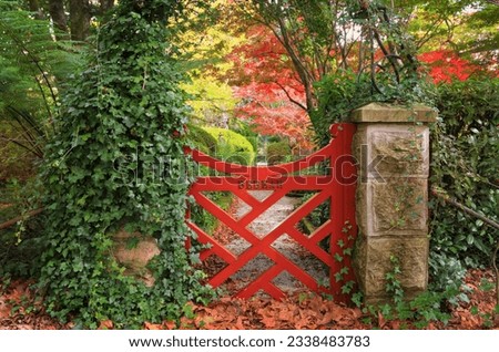 The little red gate at Bebeah Gardens in Autumn. The parklands were originally built by Edward Cox in 1880. Sprawling over 5 acres the garden includes various vistas of formal country garden with a