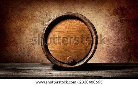 Barrel on a wooden table and brown background