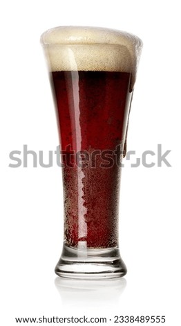 Glass of black beer isolated on white