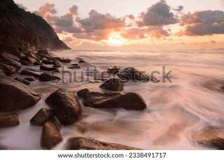 Waves flow over the rocky outcrop at Zenith Beach, Port Stephens during sunrise.