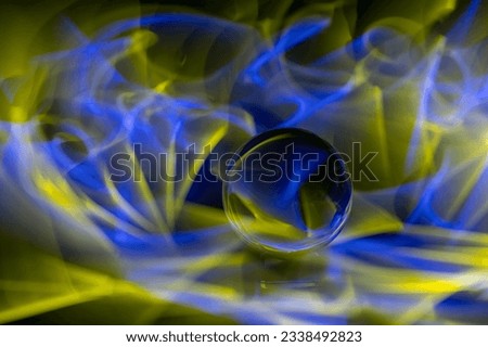 Glass ball in the play of colors
