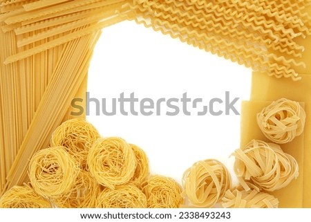 Spaghetti pasta dried food abstract border over white background.